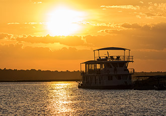 Houseboat on the Chobe River used for the photo safari Photographic safari in Chobe Botswana